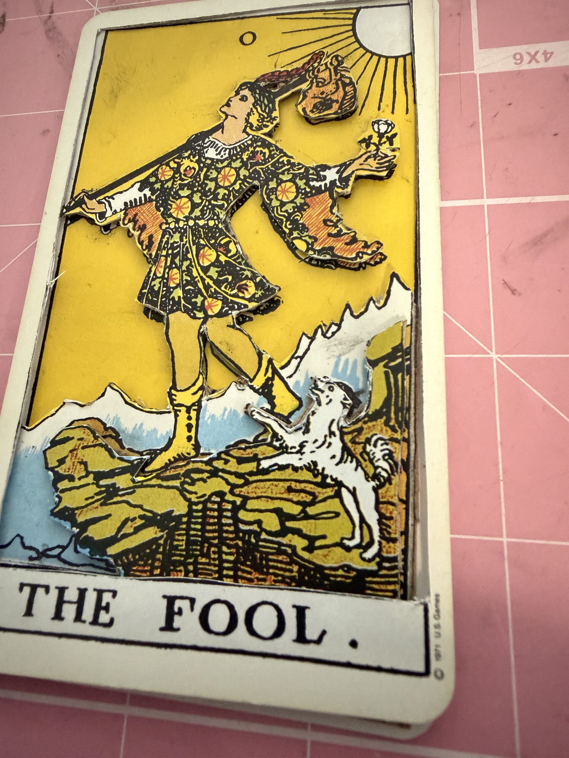 The Fool tarot card showing layered 3D handcrafted detail with raised elements